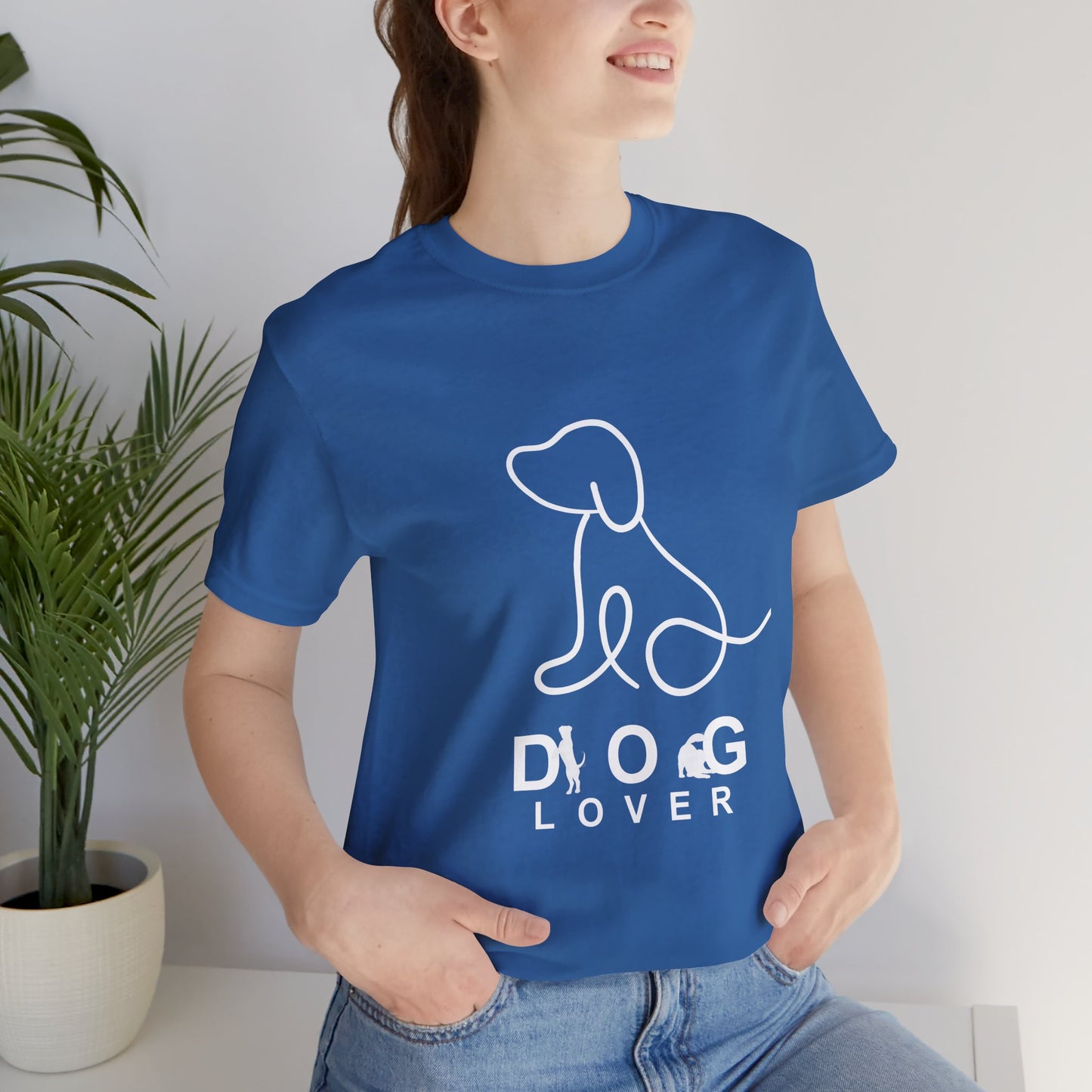 Person wearing a blue t-shirt with a dog lover graphic design.