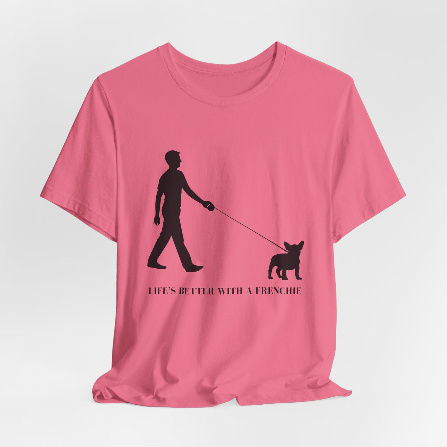 Pink t-shirt with black graphic and text 'Life's better with a Frenchie' on a white background