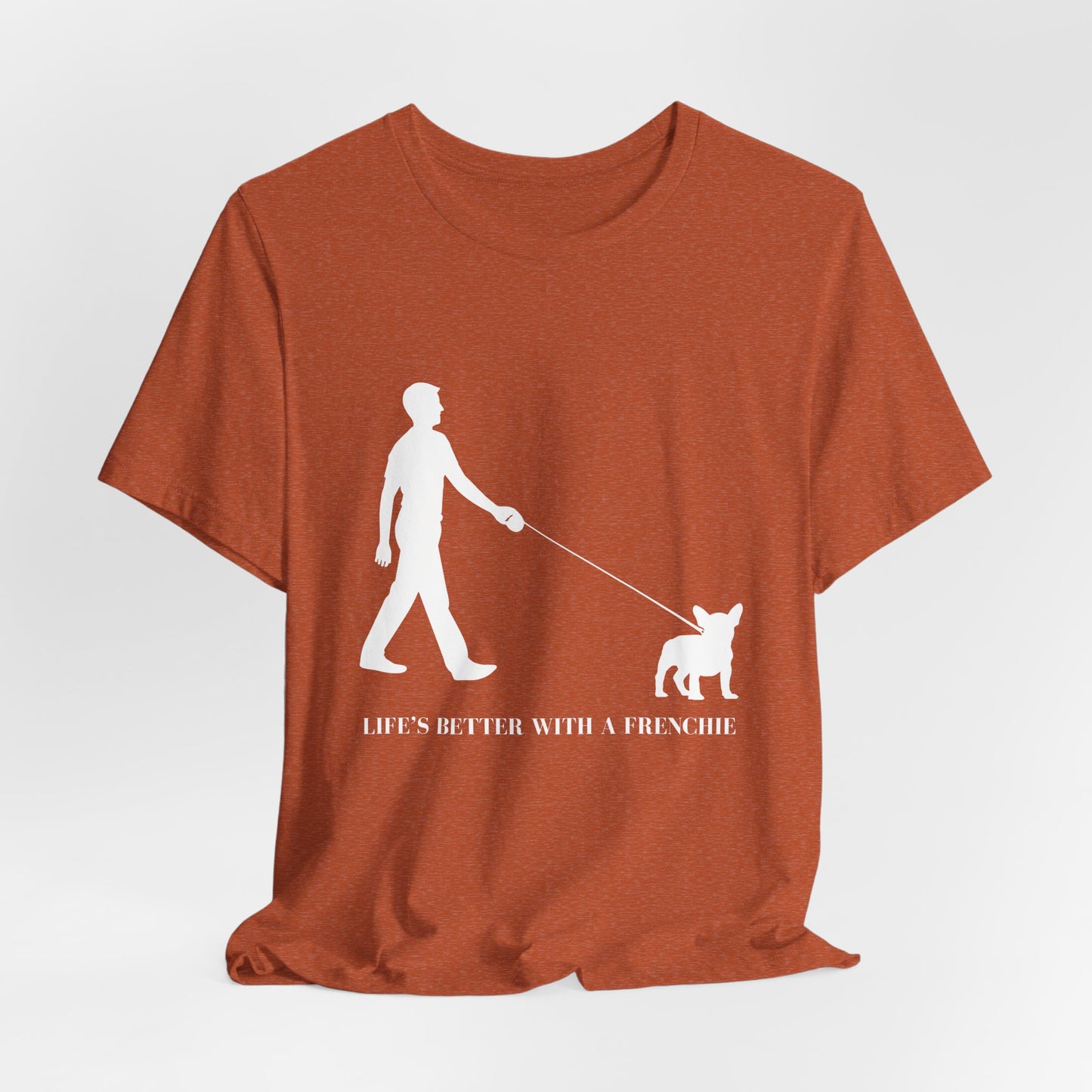 Brown t-shirt with white graphic and text 'Life's Better with a Frenchie' on a light gray background