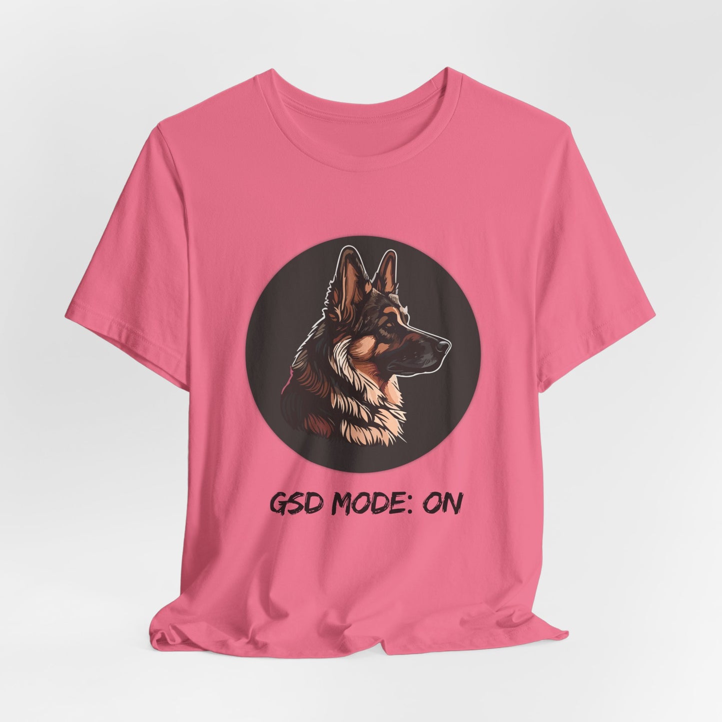 Pink t-shirt with a dog illustration and 'GSD Mode: ON' text on a white background