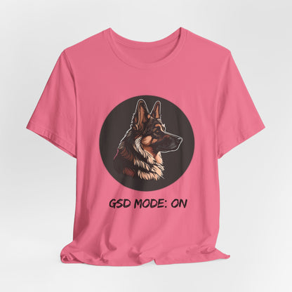 Pink t-shirt with a dog illustration and 'GSD Mode: ON' text on a white background