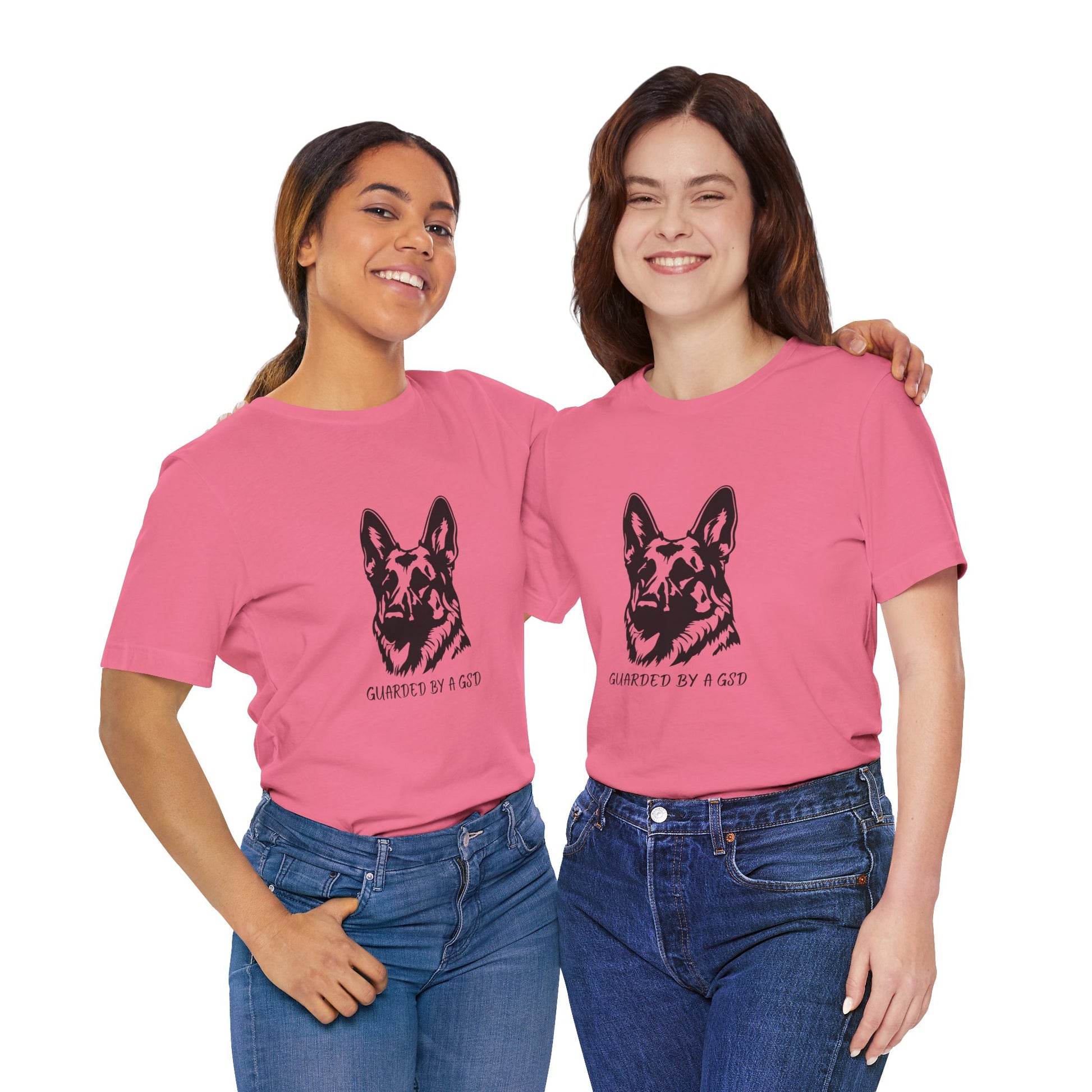 Two women wearing pink t-shirts with a dog graphic and text.