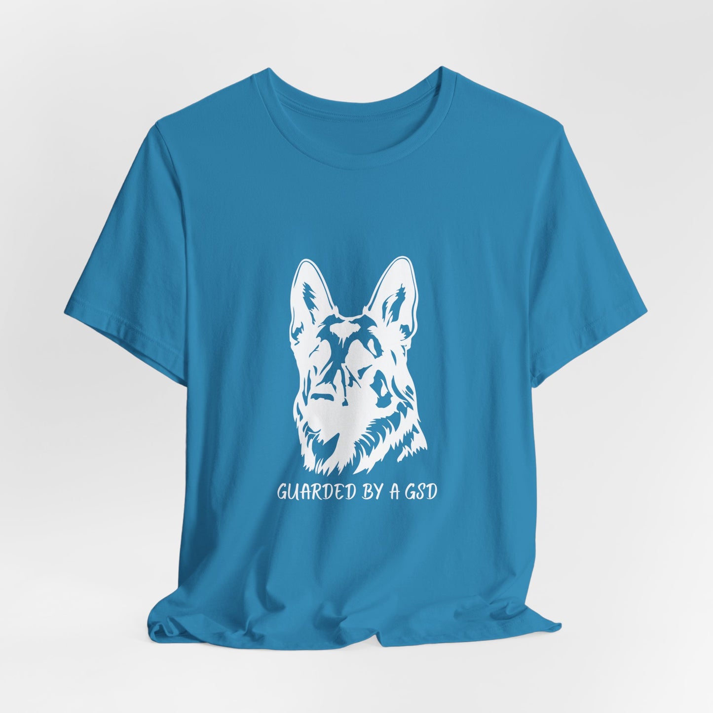 Blue t-shirt with a white German Shepherd design and text on a light gray background