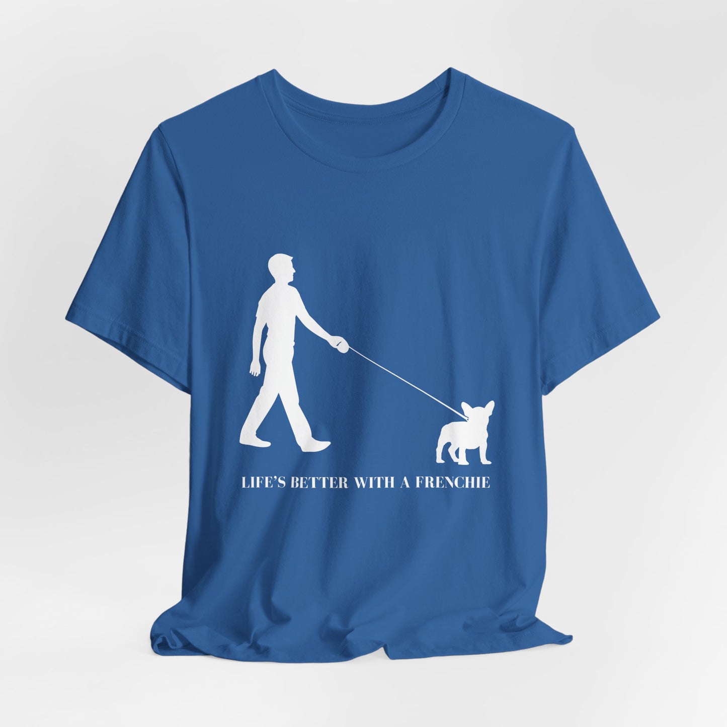 Blue t-shirt with white graphic and text 'Life's better with a Frenchie' on a light gray background