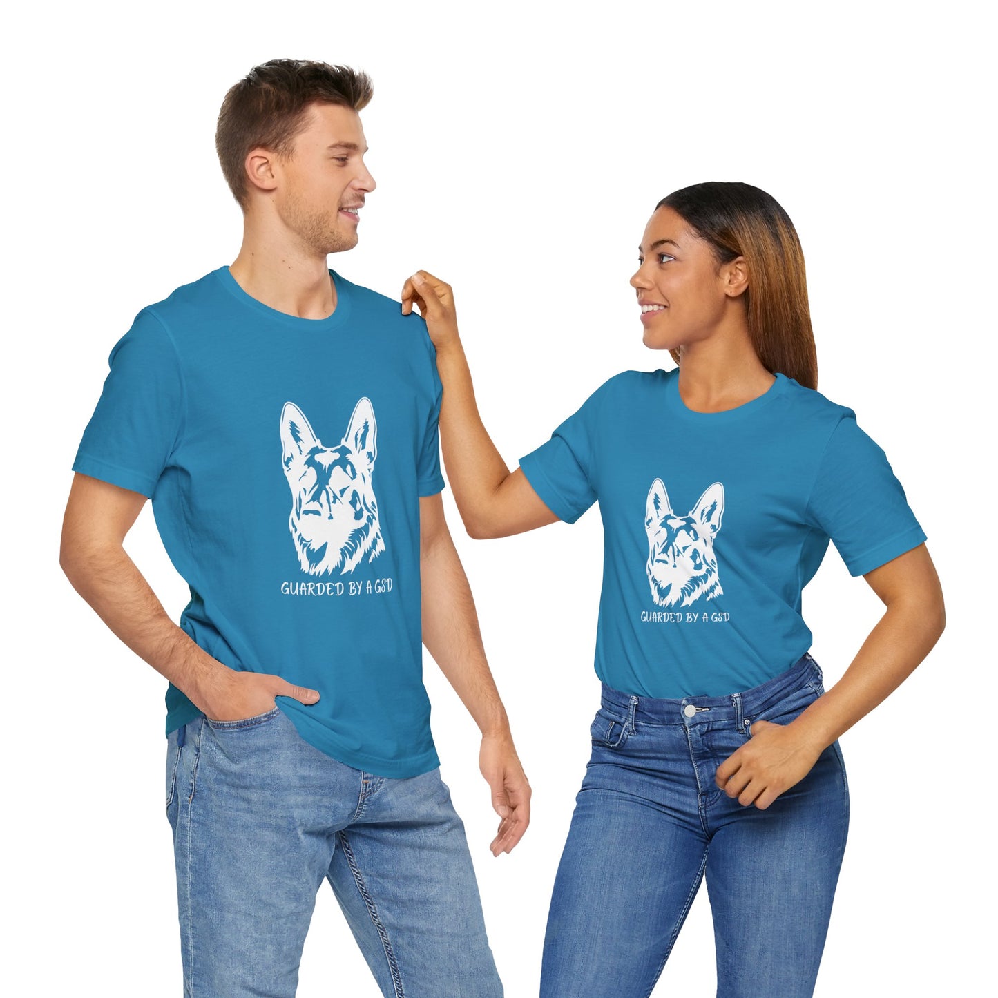 Two people wearing blue t-shirts with a dog graphic and text on a white background