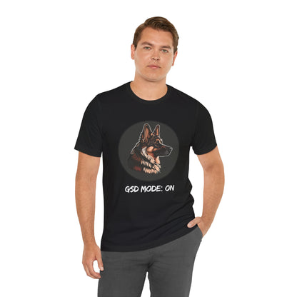 Man wearing a black t-shirt with a German Shepherd graphic and text on a white background