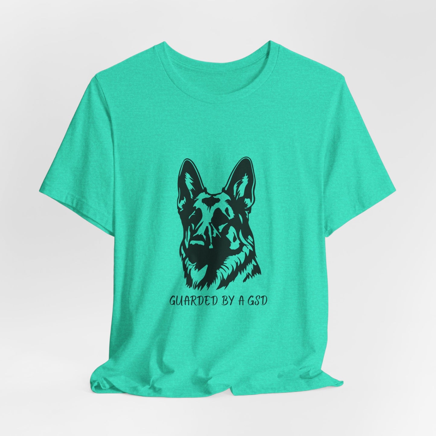 Green t-shirt with a black dog graphic and text on a white background