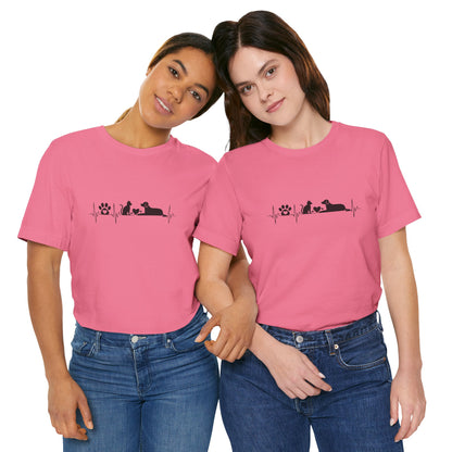 Two women wearing pink t-shirts with a black design on a white background