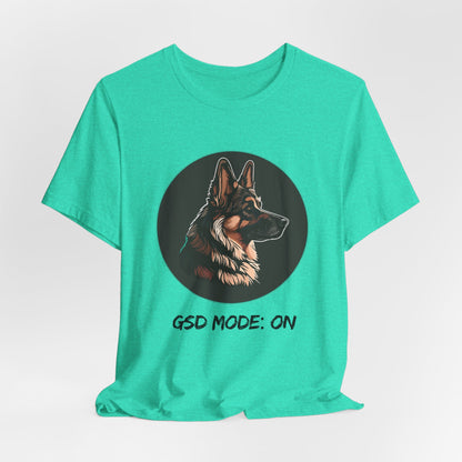 Green t-shirt with a dog illustration and 'GSD Mode: ON' text on a white background