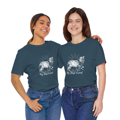Two women wearing matching blue t-shirts with a dog illustration and text on a white background