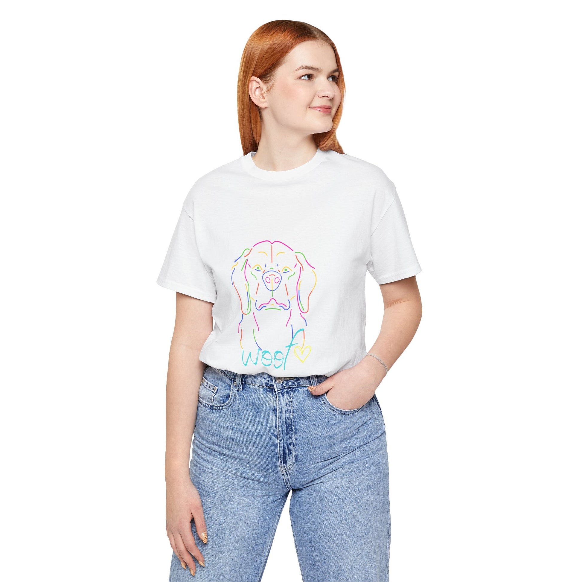 Person wearing a white t-shirt with a colorful dog graphic and 'Woof' text on a white background