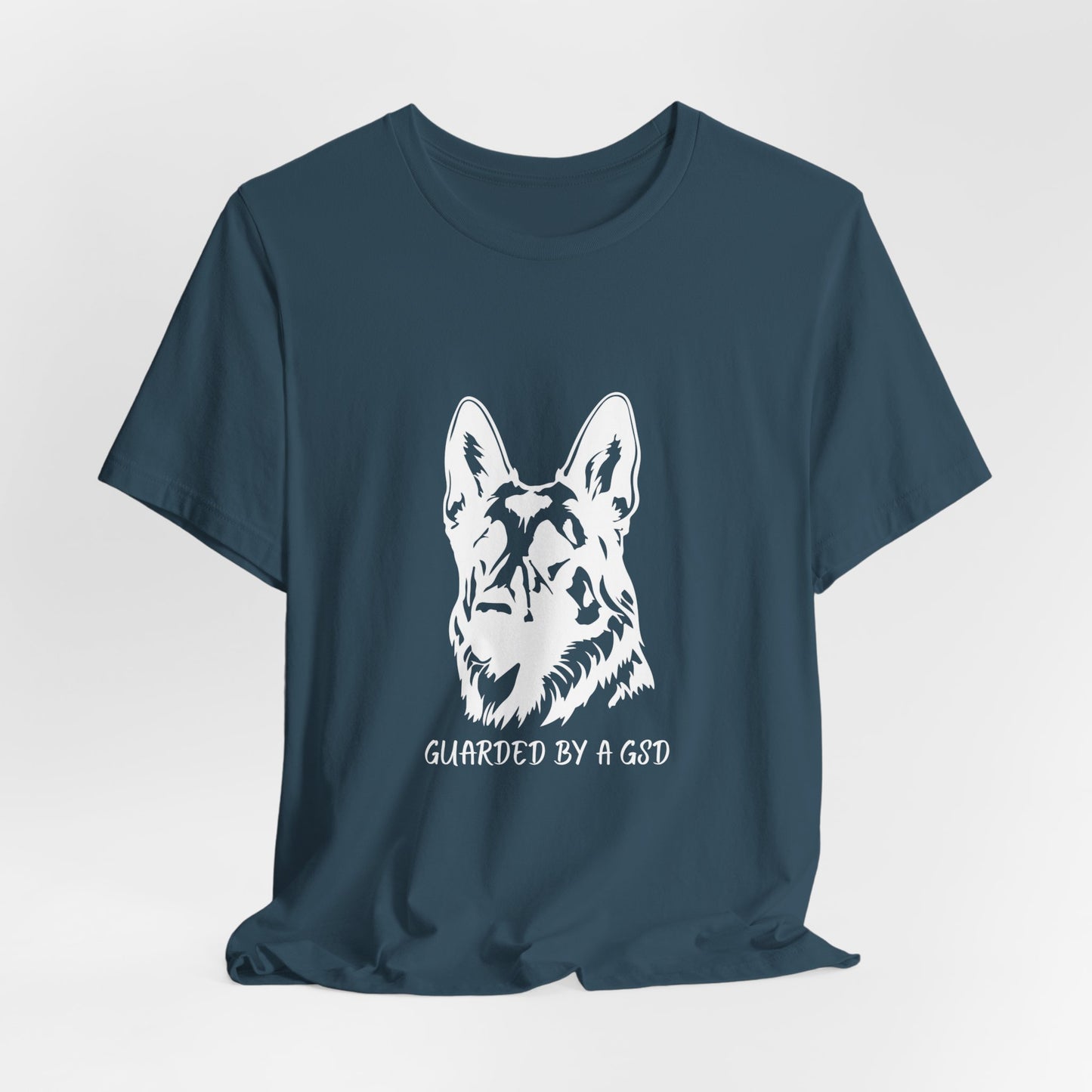Navy blue t-shirt with a white German Shepherd design and text on a light gray background
