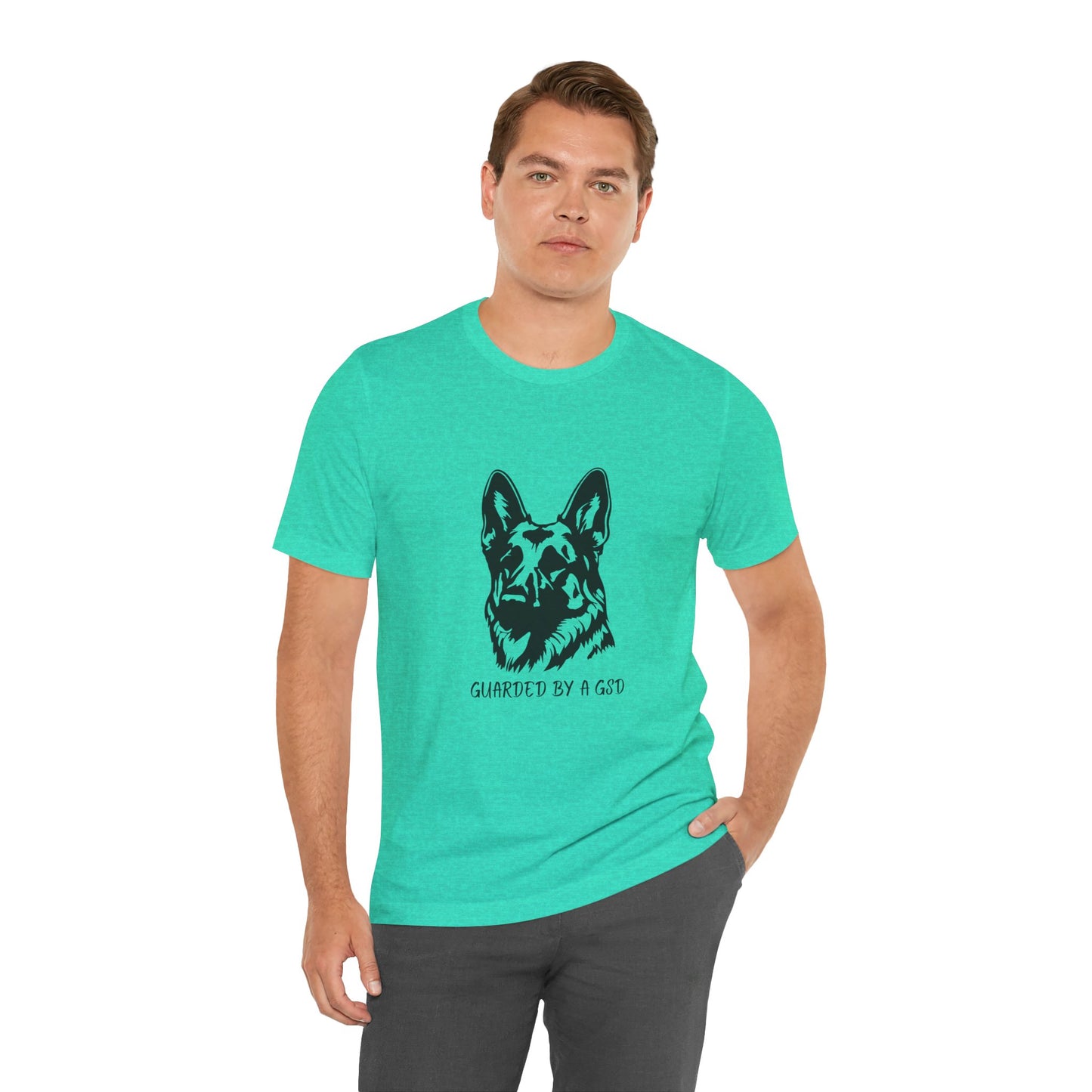 Man wearing a teal t-shirt with a graphic of a dog and text on a white background