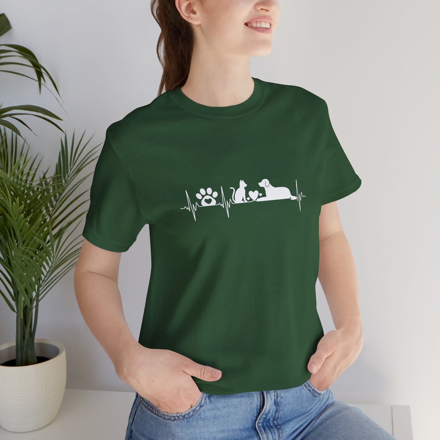 Person wearing a green t-shirt with a printed message and design.