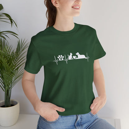 Person wearing a green t-shirt with a printed message and design.