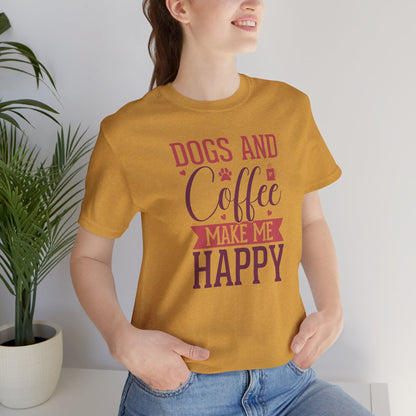 Person wearing a mustard yellow t-shirt with 'DOGS AND COFFEE MAKE ME HAPPY' text, standing indoors.