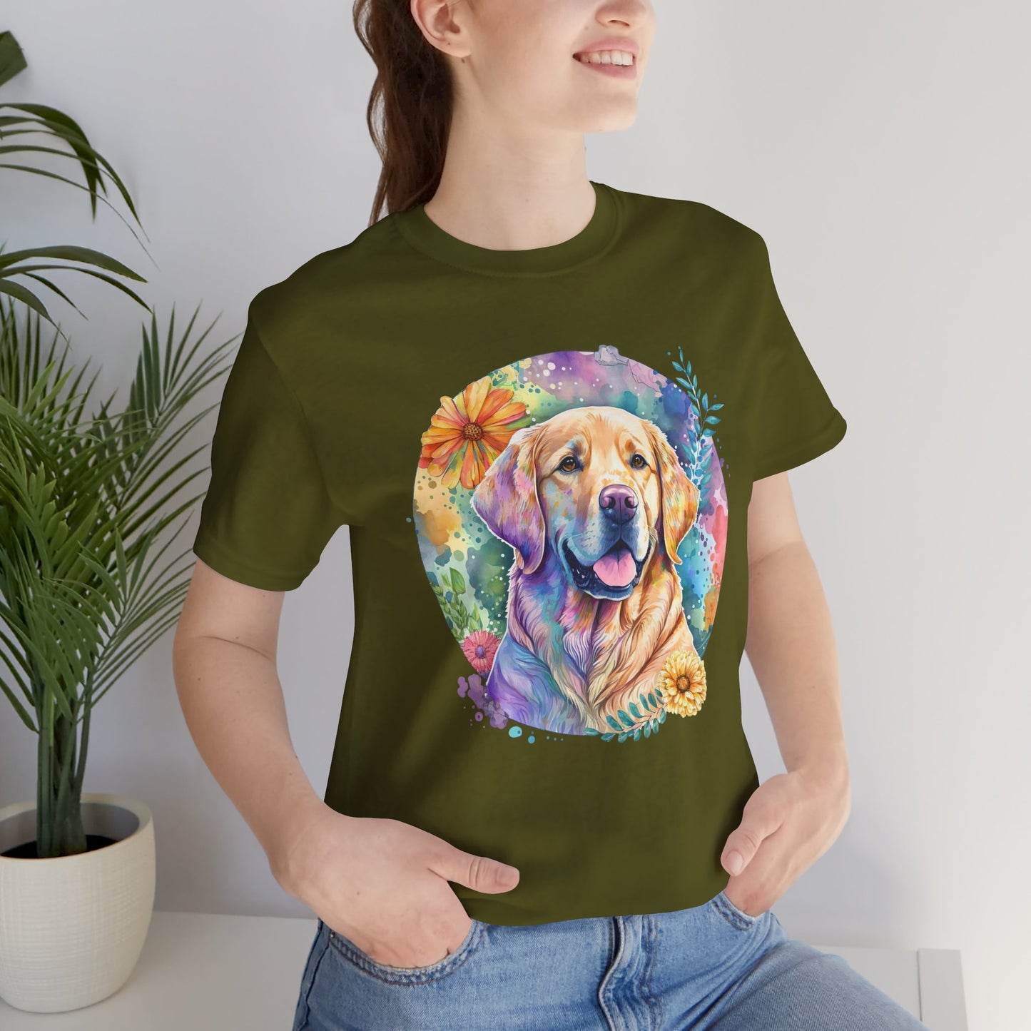 Person wearing a green t-shirt with a colorful dog graphic design.