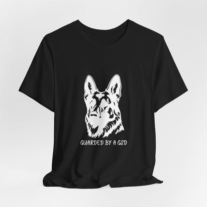 Black t-shirt with a white dog graphic and text on a light gray background