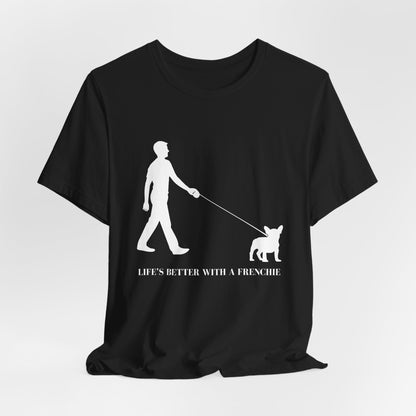 Black t-shirt with a white graphic of a person walking a dog and text 'Life's Better with a Frenchie' on a light gray background.