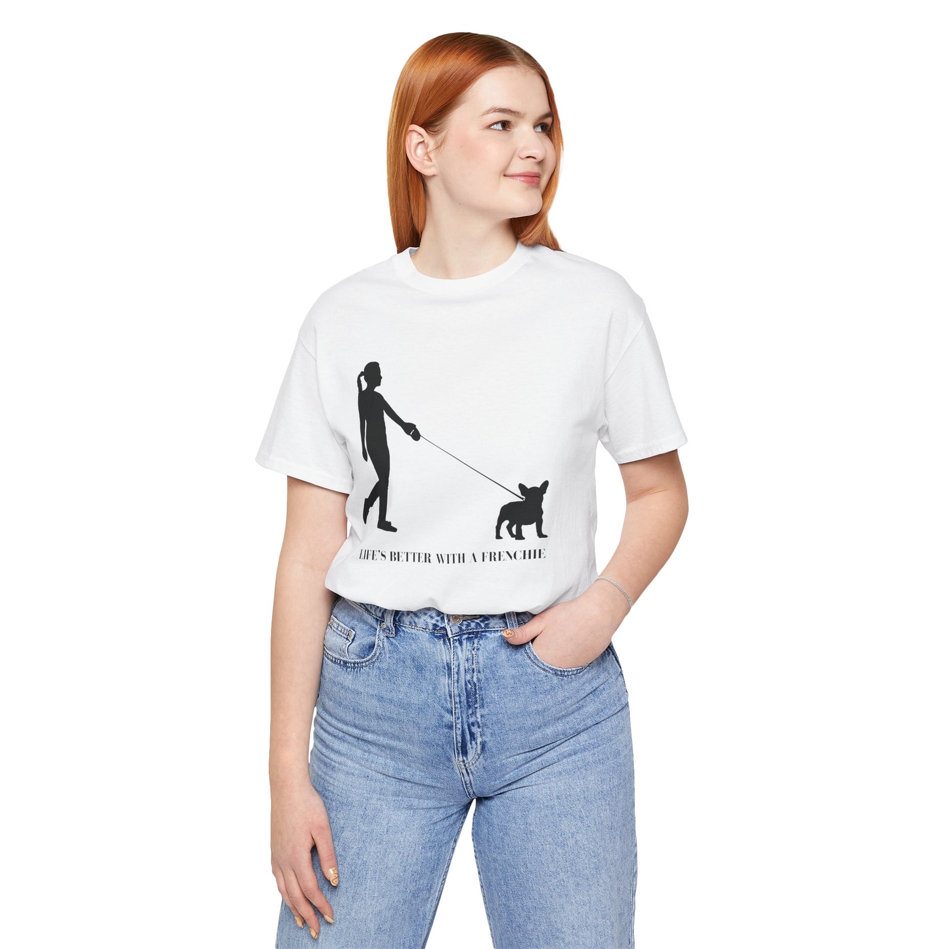 Person wearing a white t-shirt with a graphic design and text, standing against a white background