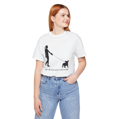 Person wearing a white t-shirt with a graphic design and text, standing against a white background