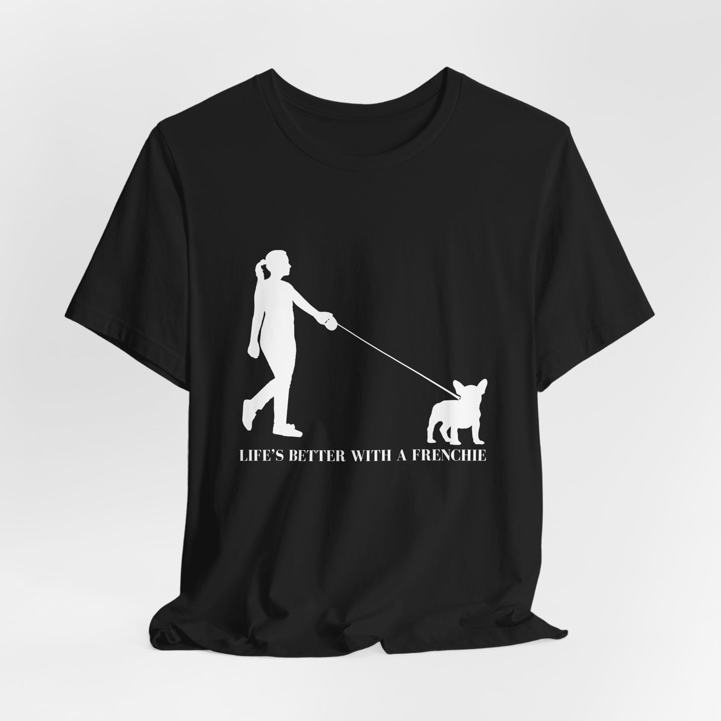Black t-shirt with white graphic and text 'Life's Better with a Frenchie' on a light gray background
