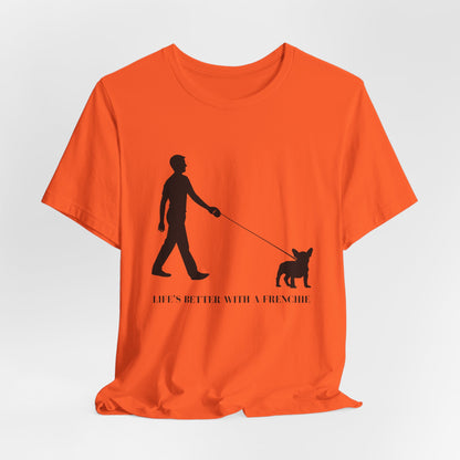Orange t-shirt with a black silhouette of a person walking a dog and text on a white background