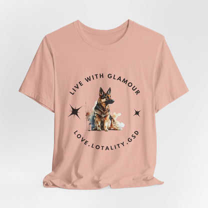 Pink t-shirt with a dog graphic and text on a light gray background