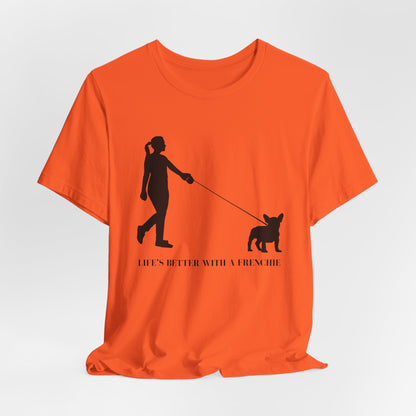Orange t-shirt with black graphic of a person walking a dog and text 'Life's better with a Frenchie' on a white background