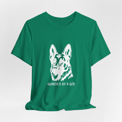 Green t-shirt with a white dog graphic and text on a light gray background