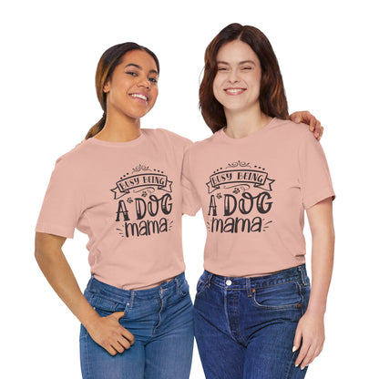 Two women wearing pink t-shirts with 'Busy Being A Dog Mama' text on a white background