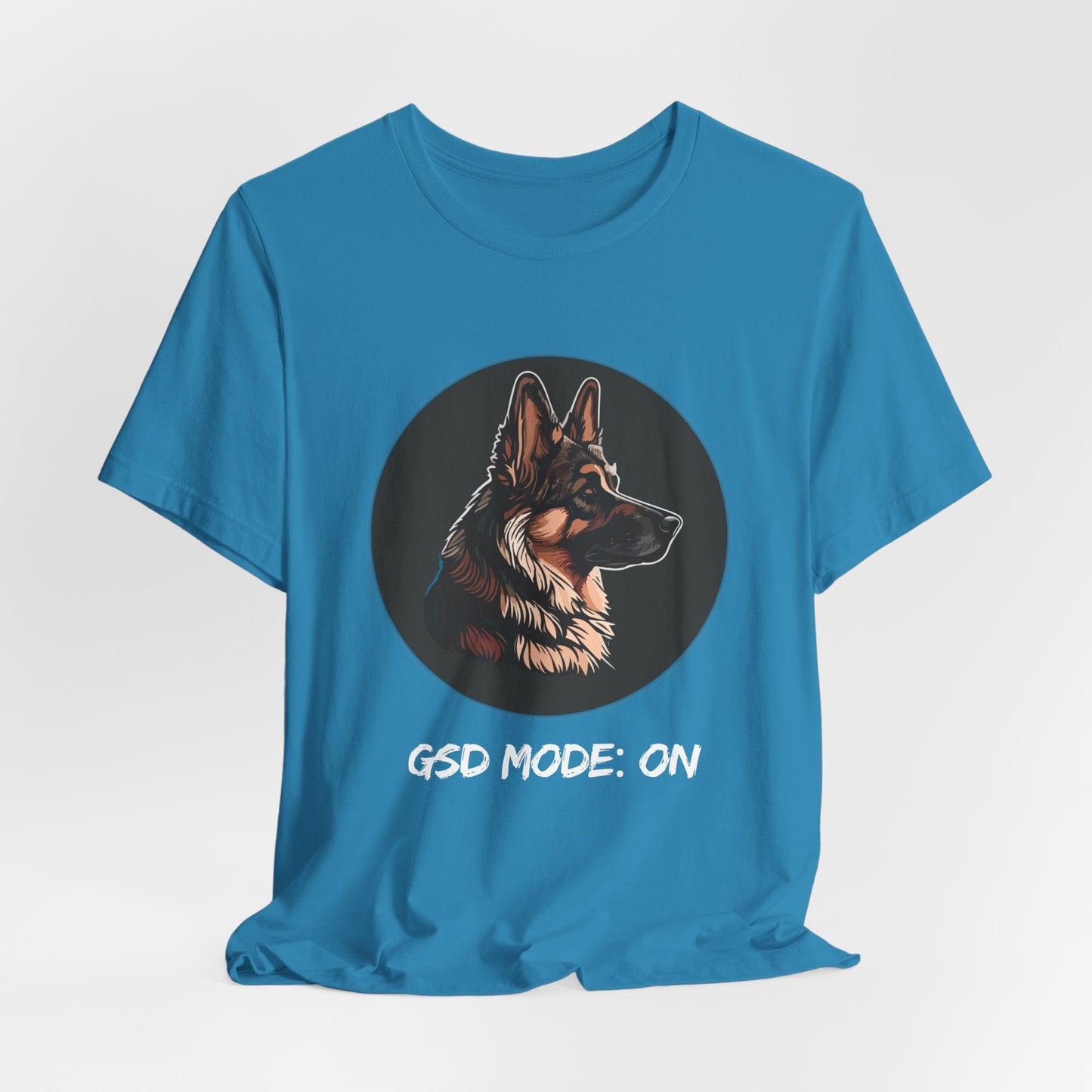 Blue t-shirt with a German Shepherd graphic and 'GSD Mode: ON' text on a light gray background