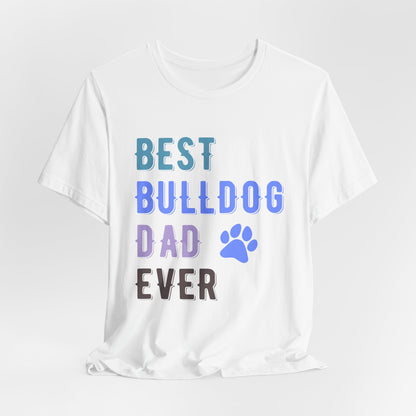 White t-shirt with 'Best Bulldog Dad Ever' text and paw print on a light gray background