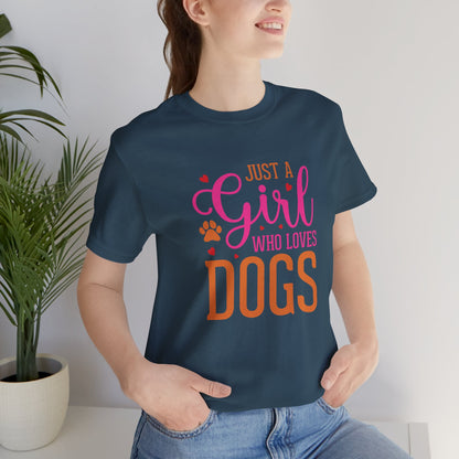 Person wearing a navy blue t-shirt with colorful text 'Just a Girl Who Loves Dogs' in a home setting.